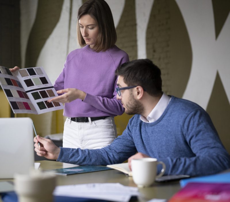 medium-shot-colleagues-picking-colors medium-shot-colleagues-picking-colors